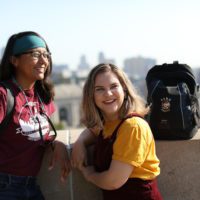 students in park t-shirts walking outside