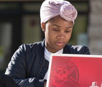 woman at laptop outside