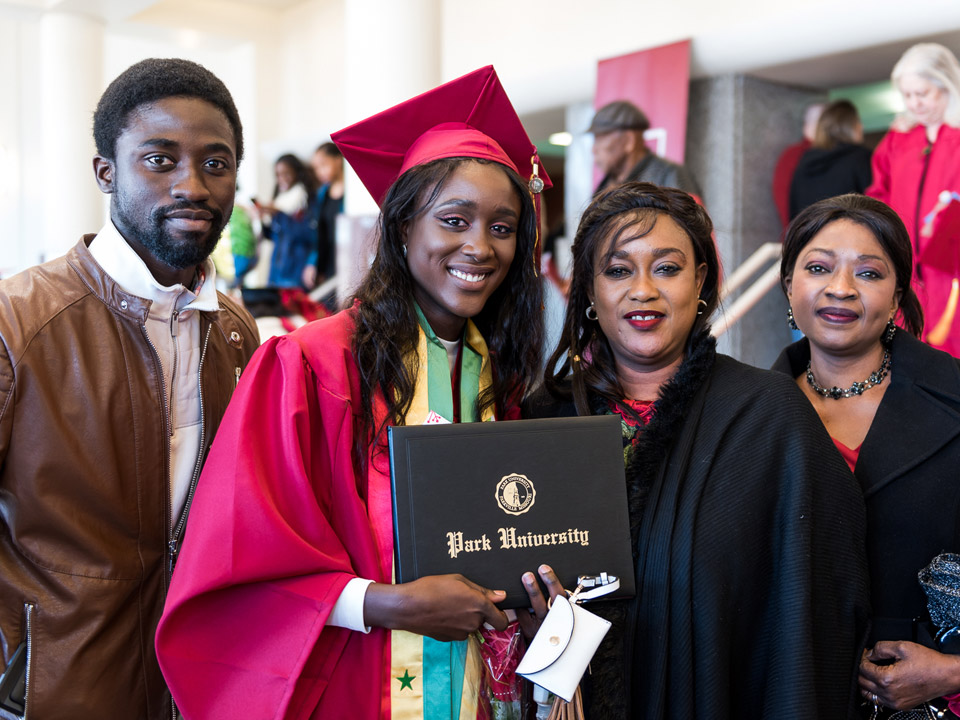 student and family with diploma