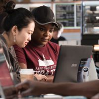 two students at laptop