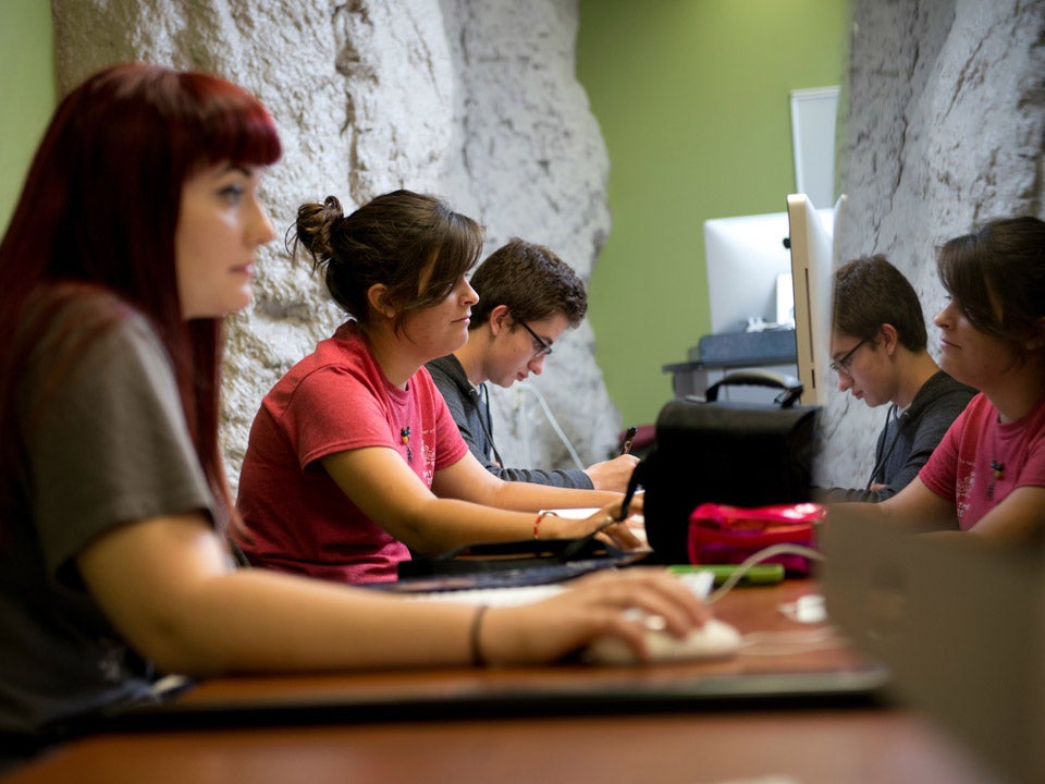 students at table in classroom
