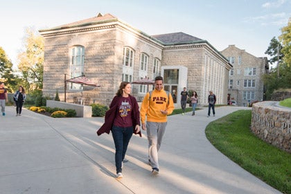 two students walking on campus