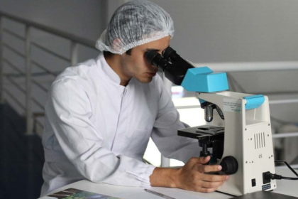 student at microscope