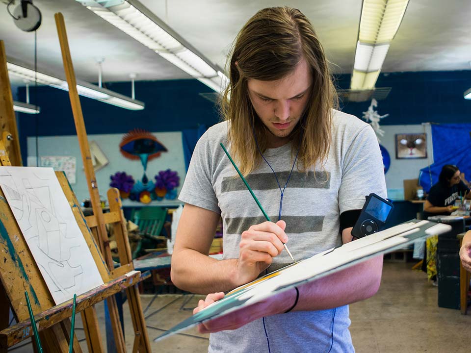 student painting in studio