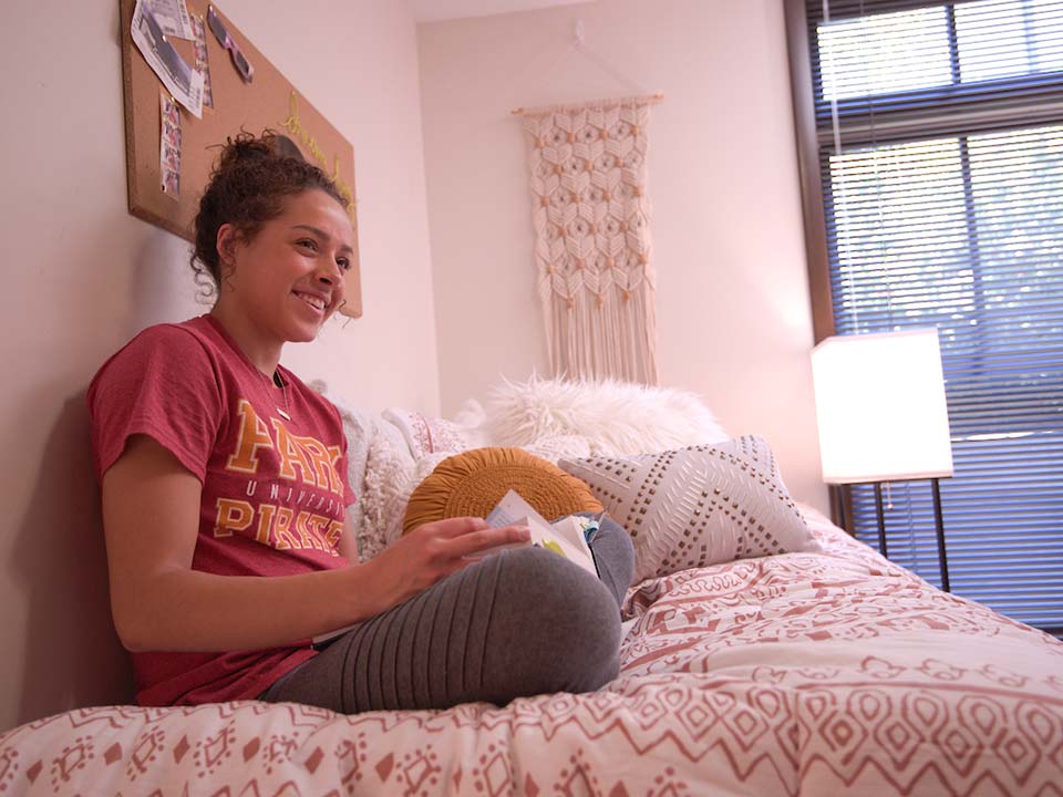 student in dorm room