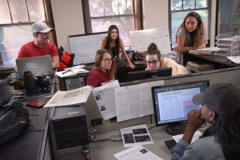 students gathered around computers