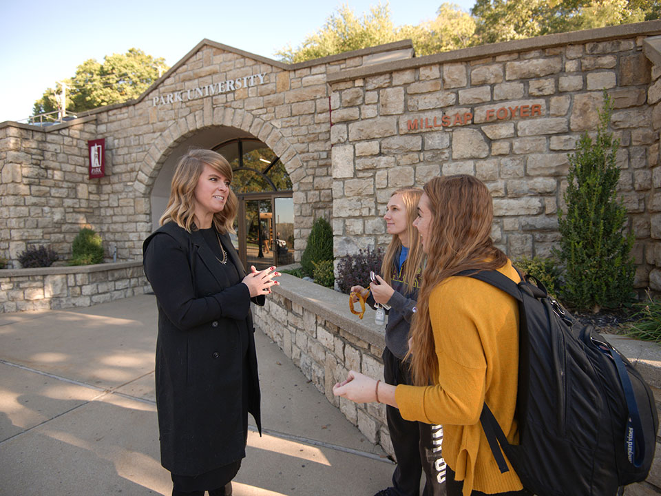 students in front of Park arch