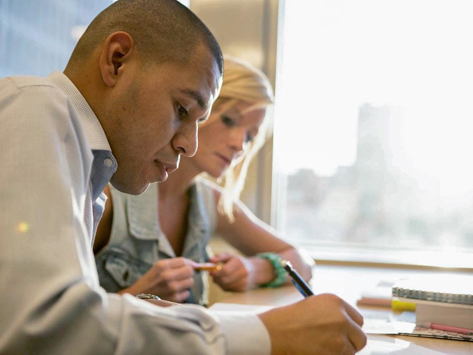 students writing in class