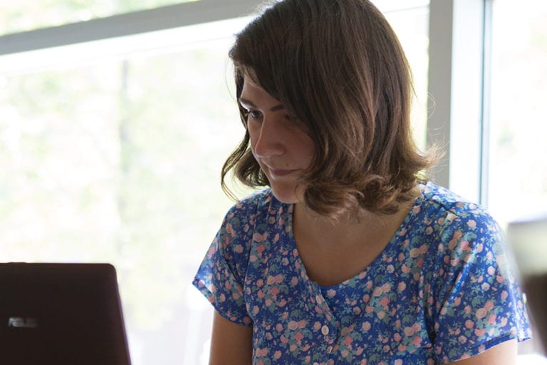 close up of woman at laptop