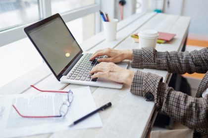 hands at laptop