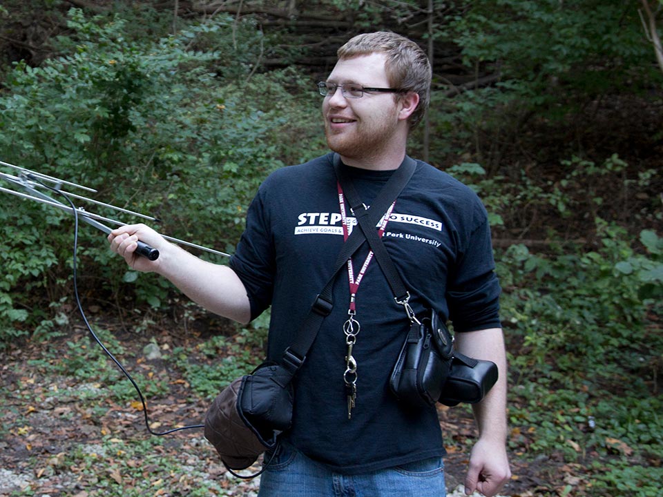 student with radio antenna