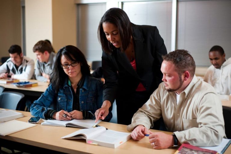 students and instructor at table