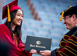 Student receiving her diploma