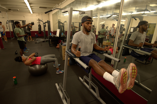 trainer in gym working out