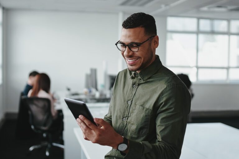 man looking at tablet