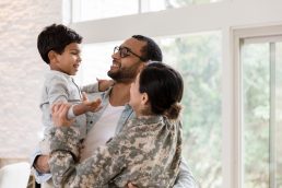 military family embracing
