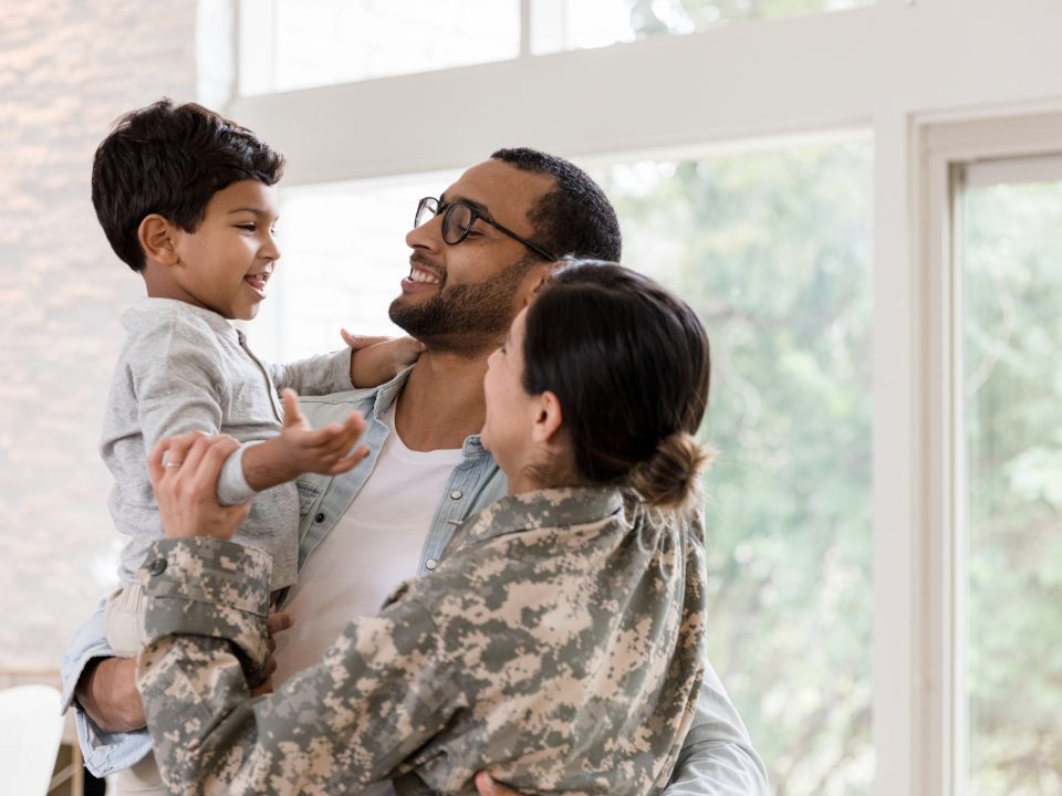 military family embracing