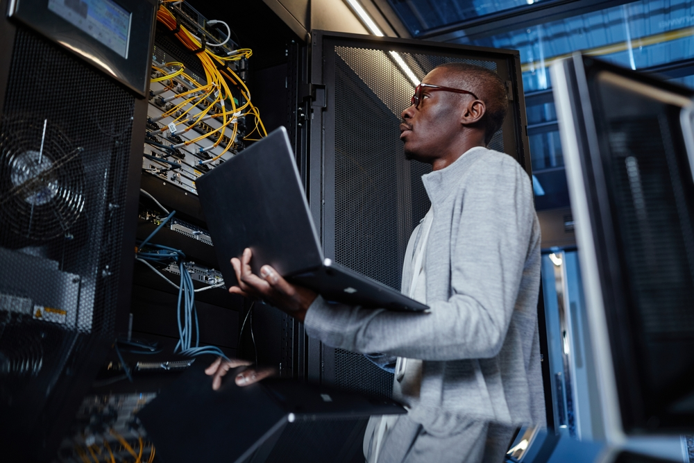 Man Fixing Computer System - Park University