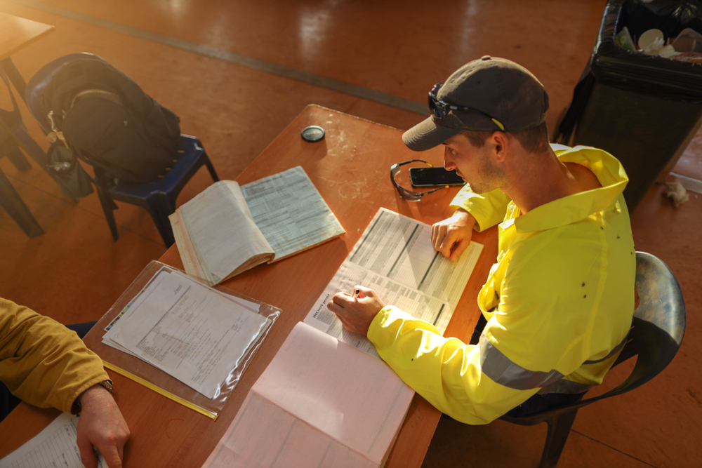 Construction Worker Filling Out Permit Park University