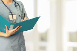 nurse holding patient chart