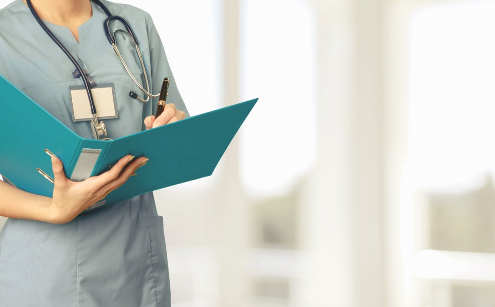 nurse holding patient chart